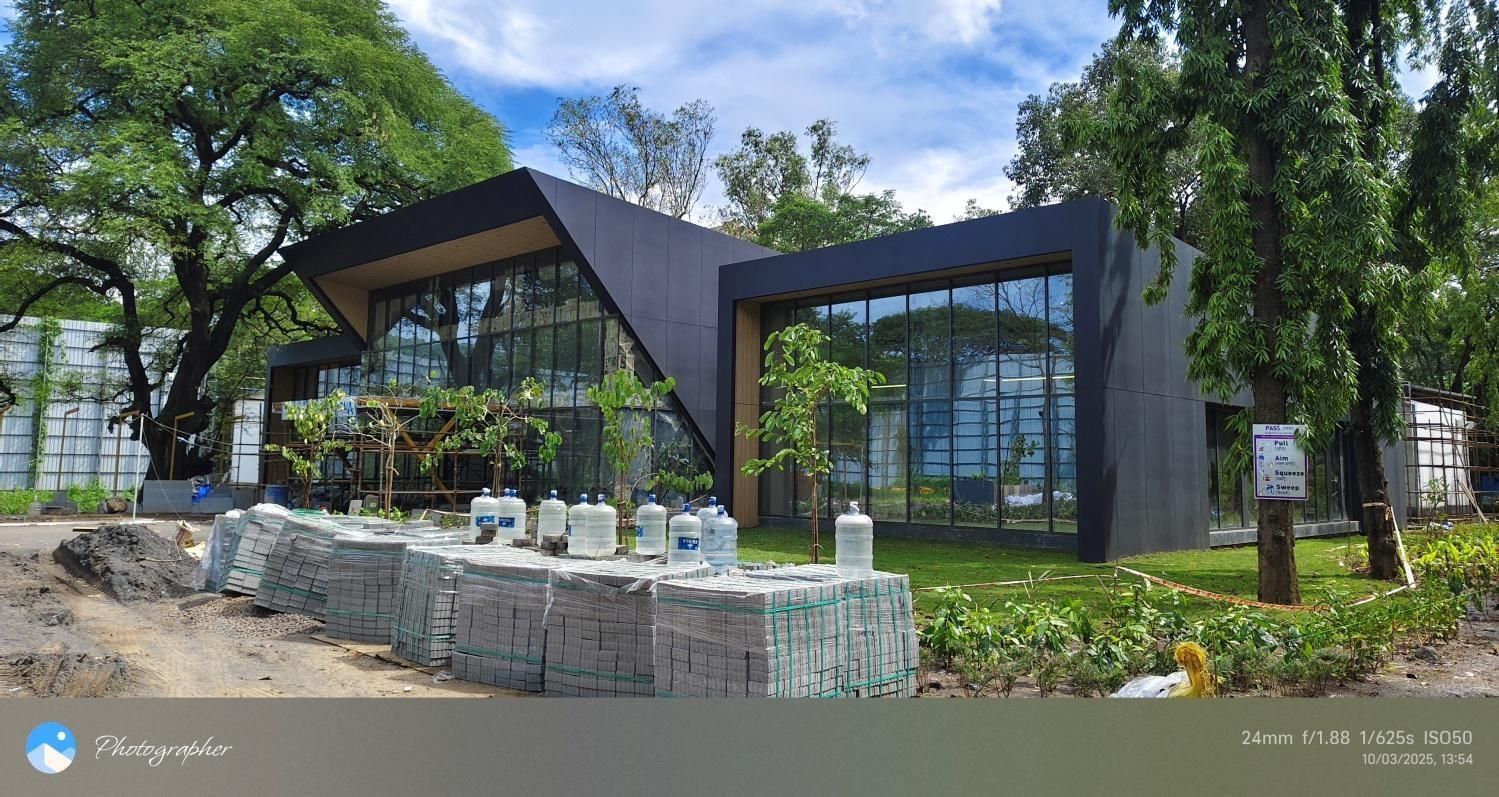 Birla Central pavilion with dark ACP cladding and full-height glazing